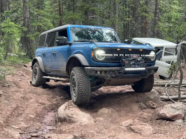 Blue Bronco on a rocky forest trail